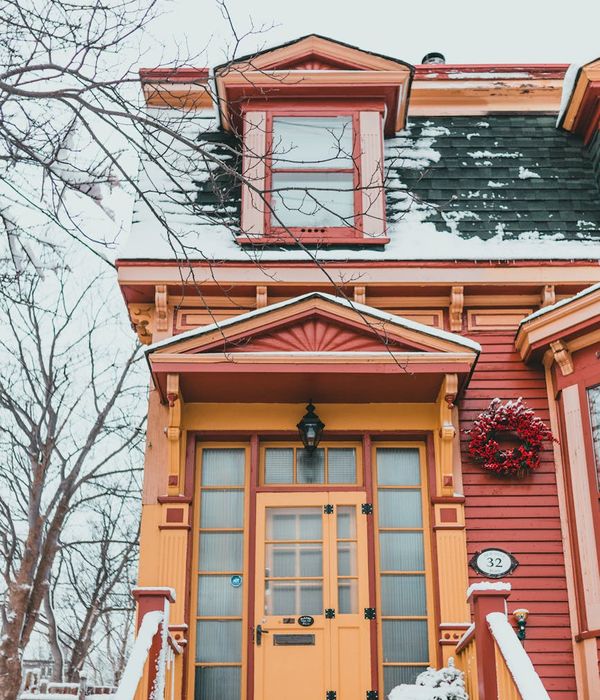 Contemporary passive house with natural wooden facade and energy-efficient triple glazing windows