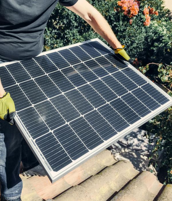 Luxury eco-villa featuring panoramic windows and sustainable green roof technology with solar integration