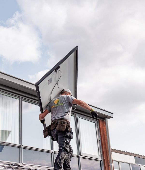 Modern sustainable eco-house with solar panels and energy-efficient design showcasing green building technology